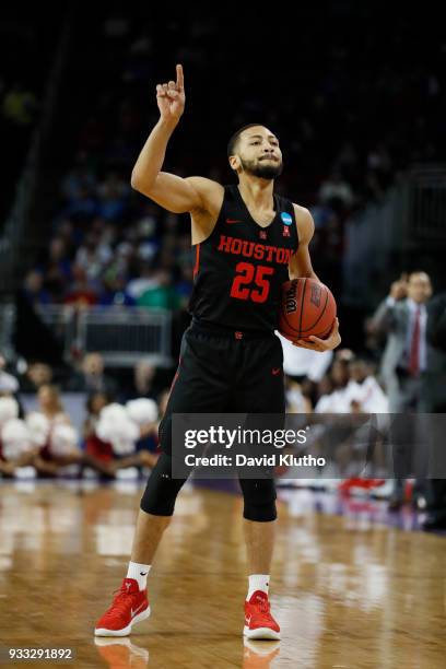 Galen Robinson Jr. #25 of the Houston Cougars signals a play during their game against the Michigan Wolverines in the second round of the 2018 NCAA...