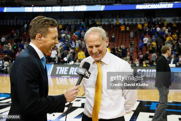 Head Coach John Beilein of the Michigan Wolverines talks with the TBS reporter after defeating the Houston Cougars in the second round of the 2018...