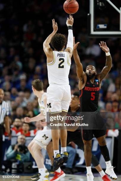 Jordan Poole of the Michigan Wolverines takes a shot against the Houston Cougars in the second round of the 2018 NCAA Photos via Getty Images Men's...