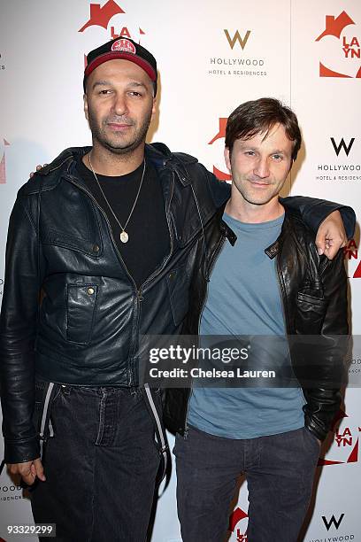 Guitarist Tom Morello of Street Sweeper Social Club and actor Breckin Meyer arrive at the Los Angeles Youth Network benefit concerts at Avalon on...