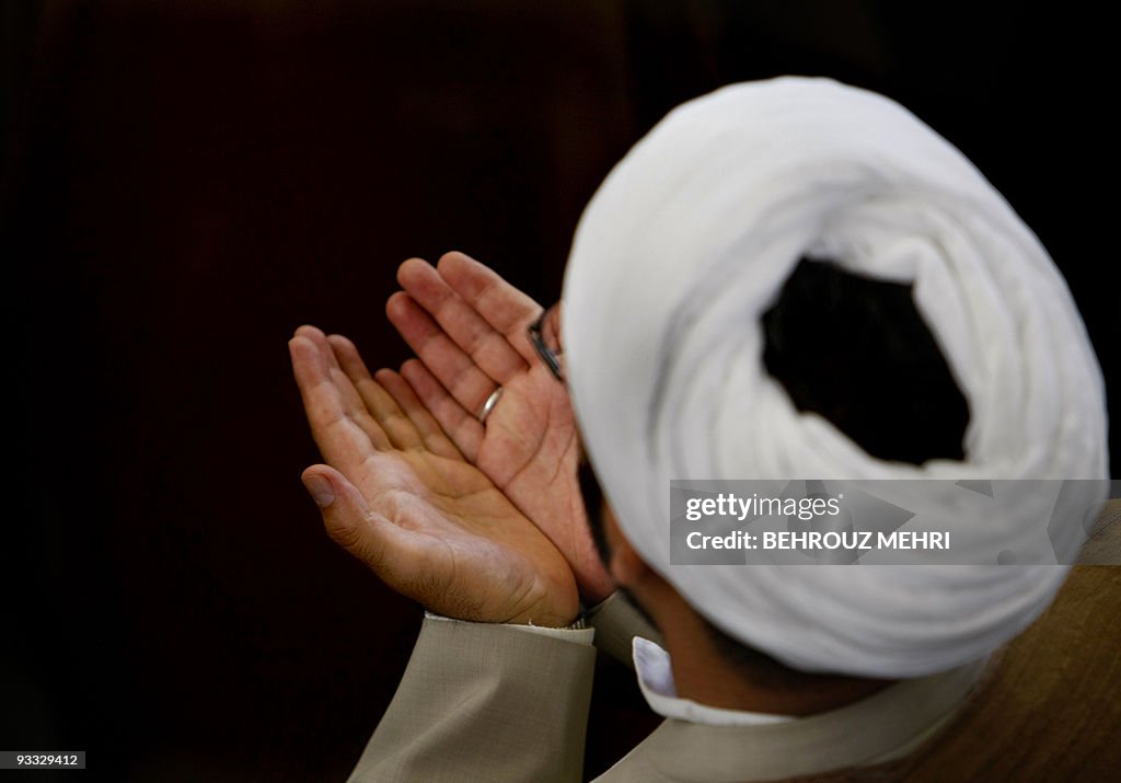 An Iranian clergyman performs the weekly