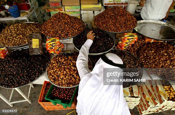 An Emirati man buys dates from a local market on August 31, 2008 one day before the start of the holy month of Ramadan. Muslims across the world are...