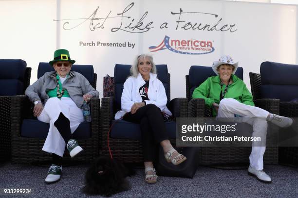 Founders' Shirley Spork, Marlene Hagge Vossler and Susie Maxwell Berning sit off the 18th green during the third round of the Bank Of Hope Founders...
