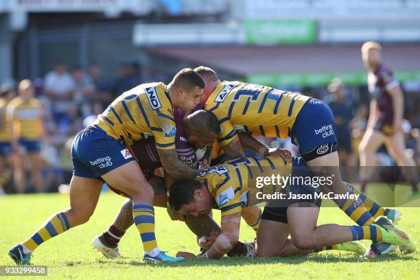 Addin Fonua-Blake of the Sea Eagles is tackled during the round two NRL match between the Manly Sea Eagles and the Parramatta Eels at Lottoland on...