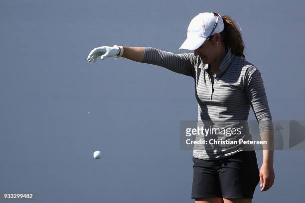 Brittany Benvenuto takes a drop ball off the 18th green during the third round of the Bank Of Hope Founders Cup at Wildfire Golf Club on March 17,...