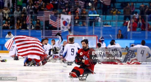 Greg Wetslake of Canada looks dejected after losing the gold medal game against United States after the Ice Hockey gold medal game between Canada and...