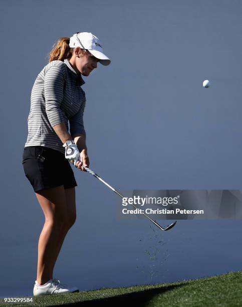 Brittany Benvenuto chips onto the 18th green during the third round of the Bank Of Hope Founders Cup at Wildfire Golf Club on March 17, 2018 in...