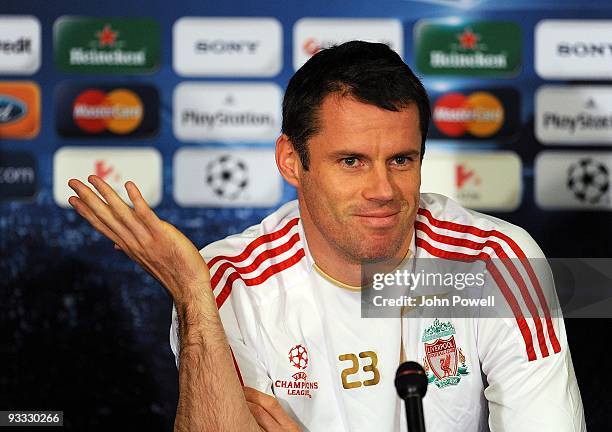 Jamie Carragher of Liverpool attends a press conference at the Ferenc Puskas Stadium ahead of the UEFA Champions League group E match between...