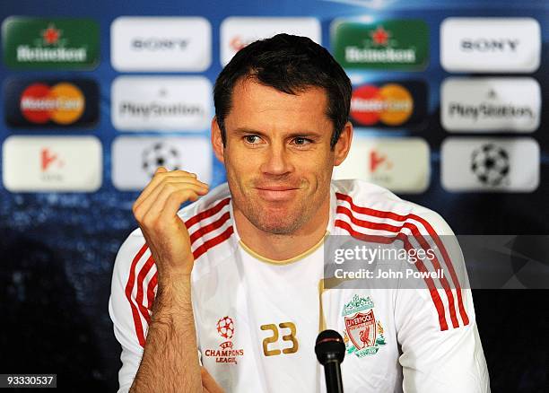 Jamie Carragher of Liverpool attends a press conference at the Ferenc Puskas Stadium ahead of the UEFA Champions League group E match between...