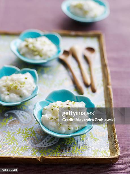 small dishes of rice pudding - rice pudding stock pictures, royalty-free photos & images