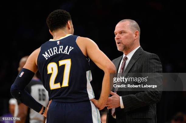 Michael Malone head coach of the Denver Nuggets talks to Jamal Murray of the Nuggets during the game against the Los Angeles Lakers on March 13, 2018...