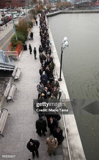 Veterans and family members wait on line to attend the "Operation: Hire Veterans Career Fair" sponsored by the Department of Labor at the Intrepid...