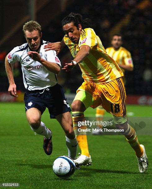 Chris Sedgwick of Preston battles with Jonas Gutierrez of Newcastle United during the Coca-Cola Championship match between Preston North End and...