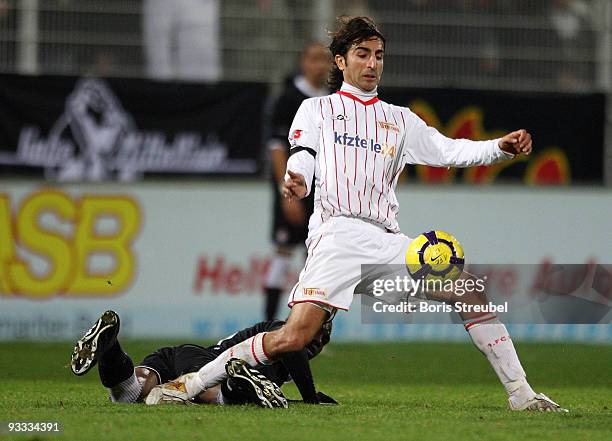 Huezeyfe Dogan of Berlin battles for the ball with Georges Mandjeck of Kaiserslautern during the Second Bundesliga match between 1. FC Union Berlin...