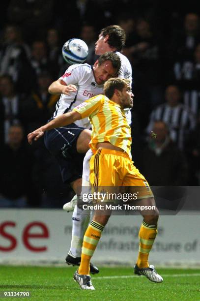 Chris Brown and Paul Parry of Preston in a ariel duel with Alan Smith Newcastle United during the Coca-Cola Championship match between Preston North...