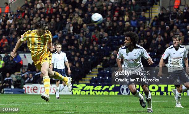 Andy Carroll of Newcastle United heads goalward during the Coca-Cola League Championship match between Preston North End and Newcastle United at...