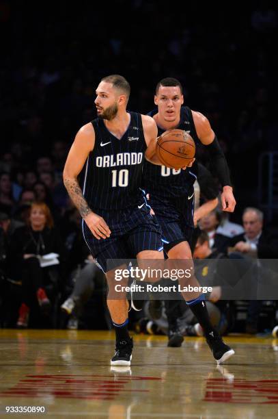 Evan Fournier of the Orlando Magic dribbles the ball against the Los Angeles Lakers as Aaron Gordon looks on on March 7, 2018 at STAPLES Center in...