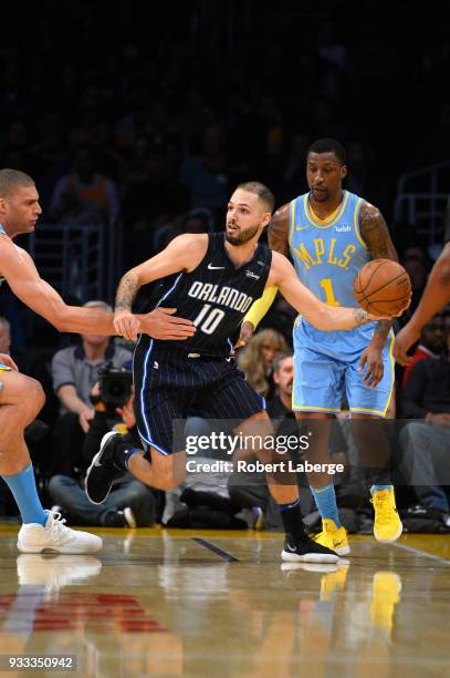 Evan Fournier of the Orlando Magic attempts a pass against the Los Angeles Lakers on March 7, 2018 at STAPLES Center in Los Angeles, California. NOTE...