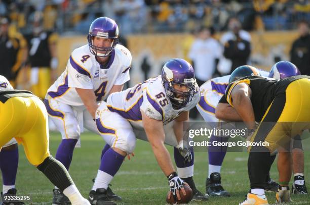 Quarterback Brett Favre of the Minnesota Vikings stands behind center John Sullivan during a game against the Pittsburgh Steelers at Heinz Field on...