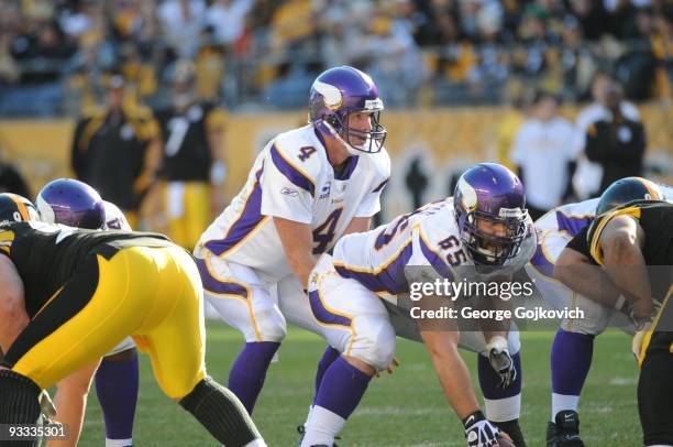 Quarterback Brett Favre of the Minnesota Vikings stands behind center John Sullivan during a game against the Pittsburgh Steelers at Heinz Field on...