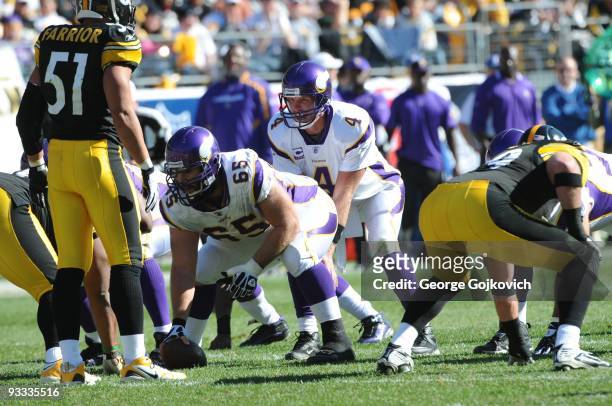 Quarterback Brett Favre of the Minnesota Vikings stands behind center John Sullivan during a game against the Pittsburgh Steelers at Heinz Field on...