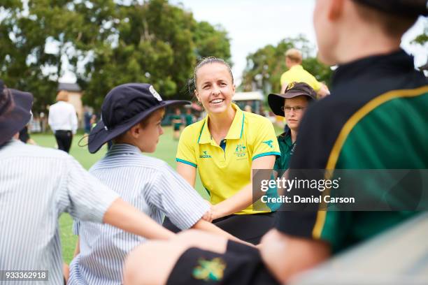Emily Smith chats with school students during the Australian Commonwealth Games Hockey Teams Announcement at Wesley College Hockey Field on March 16,...