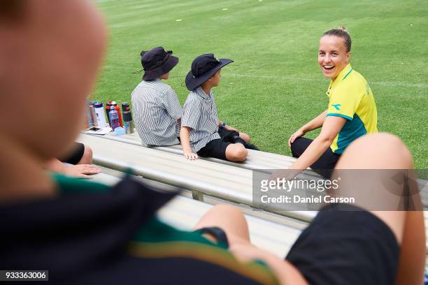 Emily Smith chats with school students during the Australian Commonwealth Games Hockey Teams Announcement at Wesley College Hockey Field on March 16,...