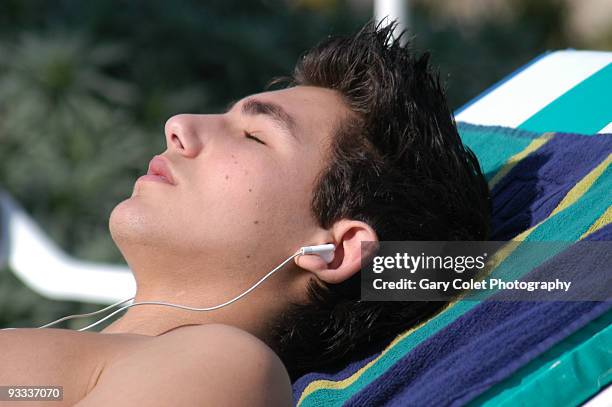 young man sunbathing - gary colet stock pictures, royalty-free photos & images