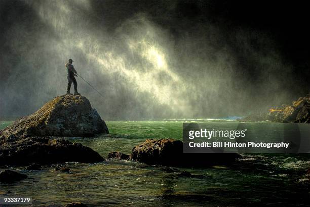 sunrise waterfall mist fisherman - bill hinton stockfoto's en -beelden