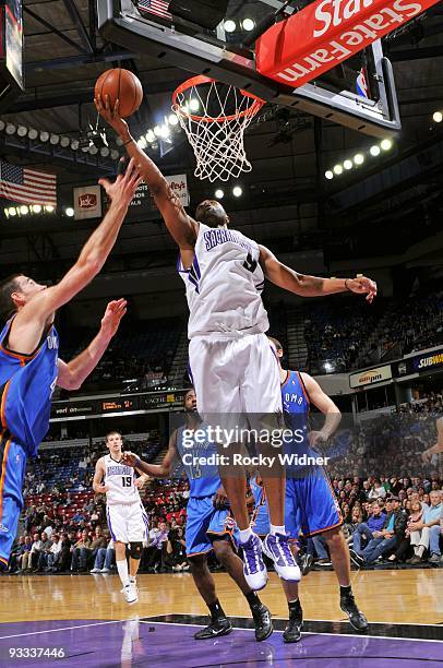 Kenny Thomas of the Sacramento Kings rebounds against Nick Collison of the Oklahoma City Thunder during the game at Arco Arena on November 10, 2009...