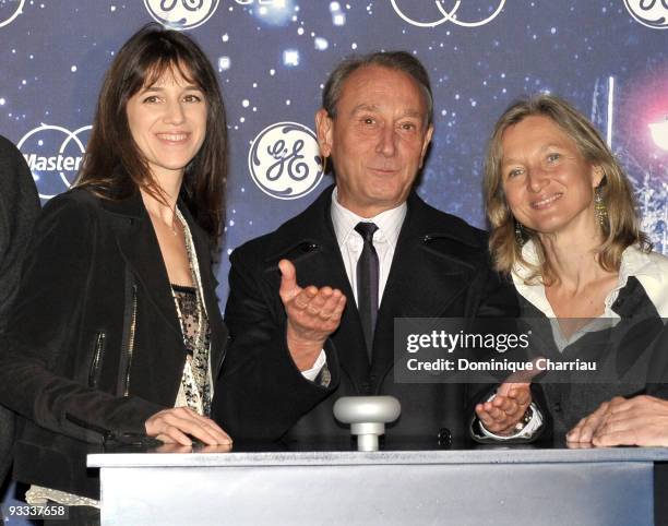 French Actress Charlotte Gainsbourg, Mayor of Paris Bertrand Delanoe and President of General Electric France Clara Gaymard attend the switching on...