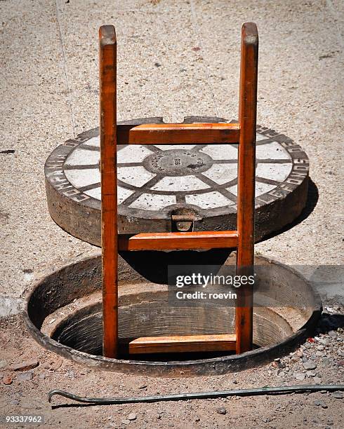 opened manhole - roevin stock pictures, royalty-free photos & images