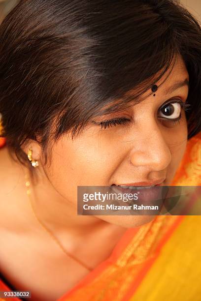 girl winking, close-up - mizanur rahman stock pictures, royalty-free photos & images