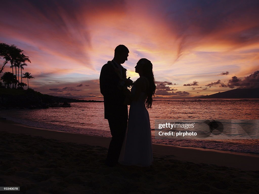 Wedding silhouette on sunset tropical beach