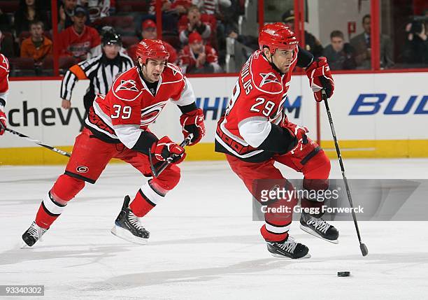Tom Kostopoulos of the Carolina Hurricanes skates with the puck during a NHL game against the Tampa Bay Lighting on November 21, 2009 at RBC Center...