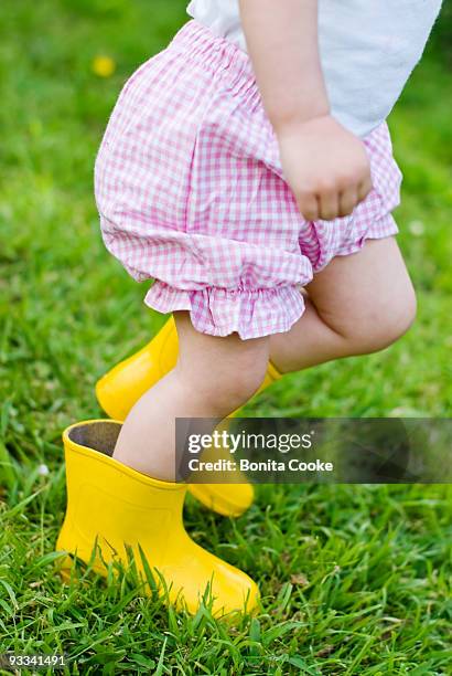 little girl running - bloomers stock pictures, royalty-free photos & images