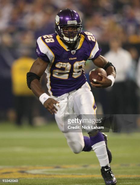 Adrian Peterson of the Minnesota Vikings rushes against the Seattle Seahawks at Hubert H. Humphrey Metrodome on November 22, 2009 in Minneapolis,...