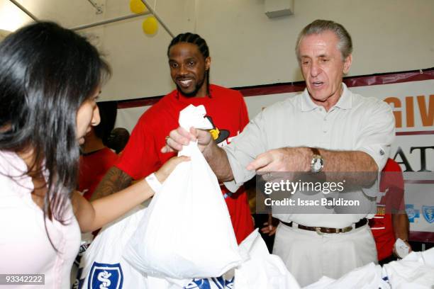 Udonis Haslem and President Pat Riley of the Miami Heat participate in the Miami Heat's Annual Thanksgiving in Overtown Ceremony on November 23, 2009...