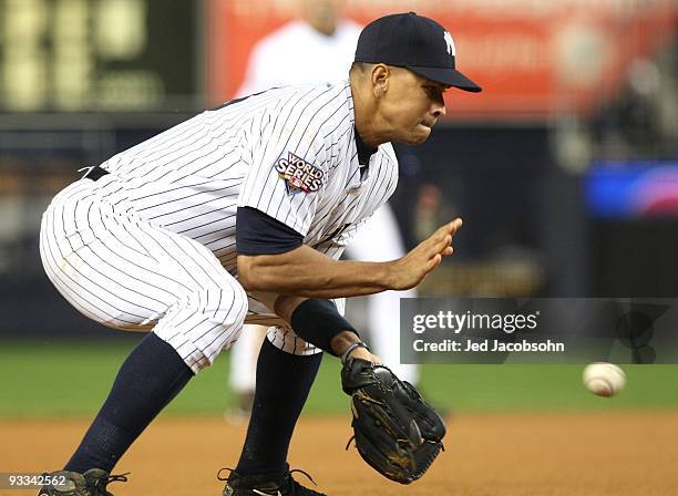 Alex Rodriguez of the New York Yankees fields a ball against the Philadelphia Phillies in Game One of the 2009 MLB World Series at Yankee Stadium on...