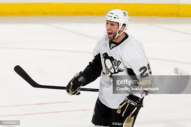 Maxime Talbot of the Pittsburgh Penguins celebrates the goal scored by Pascal Dupuis against the Florida Panthers in the third period on November 23,...