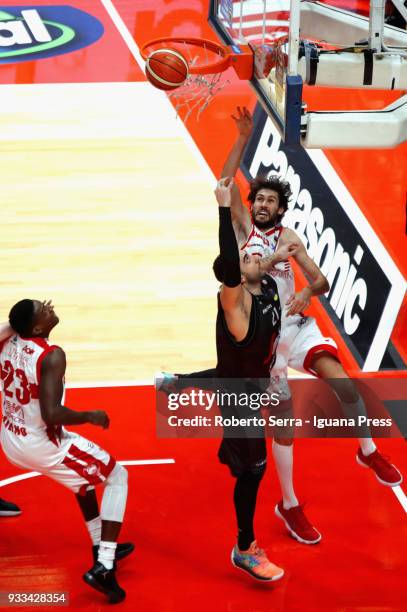 Pietro Aradori of Segafredo competes with Awadu Abass Abass and Davide Pascolo of EA7 during the LBA LegaBasket of Serie A match between Virtus...