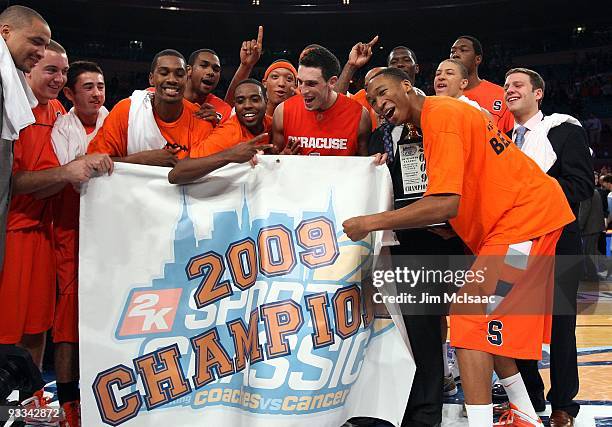 The Syracuse Orange celebrate after defeating the North Carolina Tar Heels to win the championship game of the 2K Sports Classic on November 20, 2009...