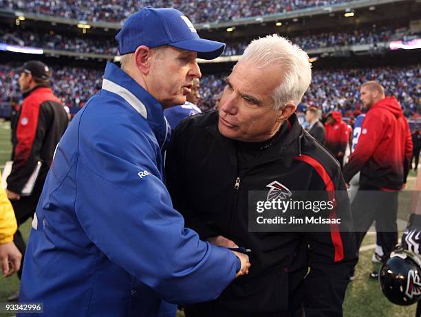 Head coach Mike Smith of the Atlanta Falcons shakes hands with head coach Tom Coughlin of the New York Giants after their game on November 22, 2009...