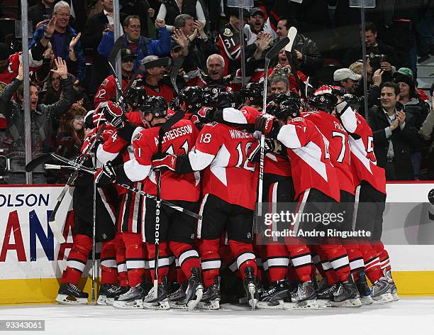 The Ottawa Senators celebrate their overtime win against the Washington Capitals at Scotiabank Place on November 23, 2009 in Ottawa, Ontario, Canada.