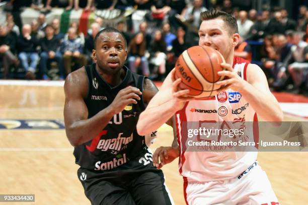 Dairis Bertans of EA7 competes with Oliver Lafayette of Segafredo during the LBA LegaBasket of Serie A match between Virtus Segafredo Bologna and...