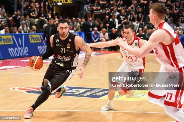 Pietro Aradori of Segafredo competes with Dairis Bertans and Arturas Gudaitis of EA7 during the LBA LegaBasket of Serie A match between Virtus...