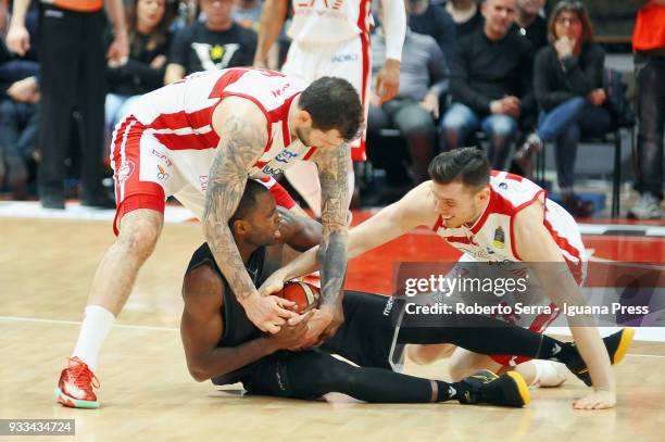 Oliver Lafayette of Segafredo competes with Vladimir Micov and Dairis Bertans of EA7 during the LBA LegaBasket of Serie A match between Virtus...