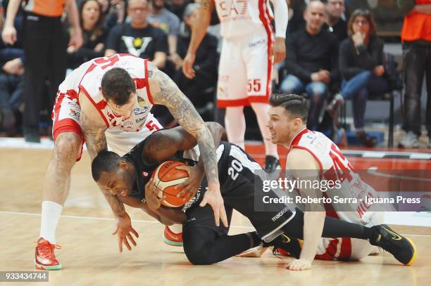 Oliver Lafayette of Segafredo competes with Vladimir Micov and Dairis Bertans of EA7 during the LBA LegaBasket of Serie A match between Virtus...