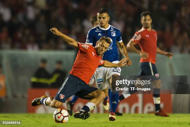 Nicolas Domingo of Independiente and John Duque of Millonarios battle for the ball during the Copa Conmebol Libertadores match between Independiente...