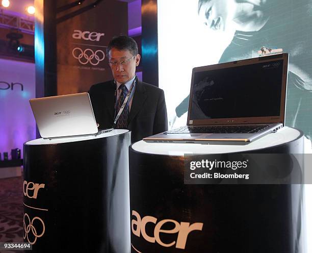 Man uses an Acer Inc. Laptop computer at a media event in Beijing, China, on Tuesday, Nov. 24, 2009. Acer Inc. Is the world's third-largest maker of...